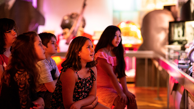 A group of children from day camp attend the multimedia show at the Louis S. St. Laurent National Historic Site.