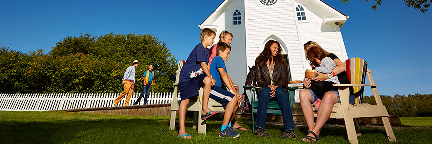 Interpreter and visitors in front of Church