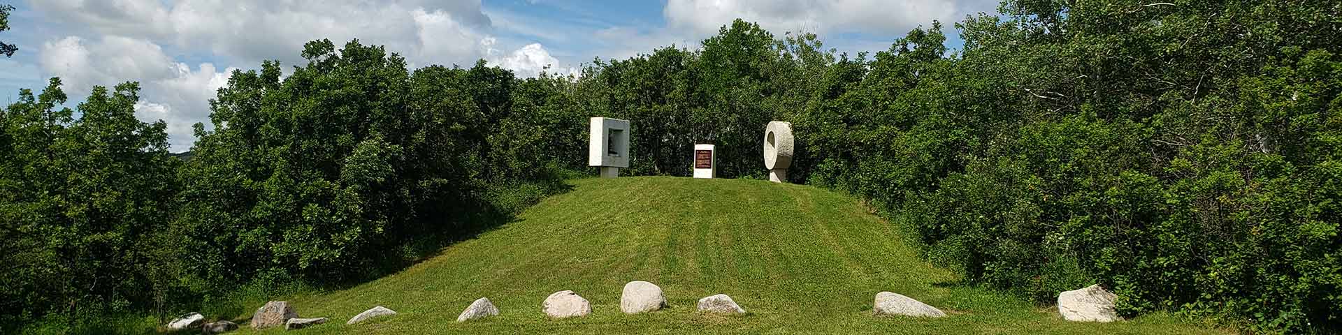 View of the sculptures and the Historic Sites and Monuments Board plaque at Fort Espérance