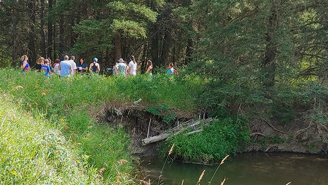 visitors walking with a guide. 