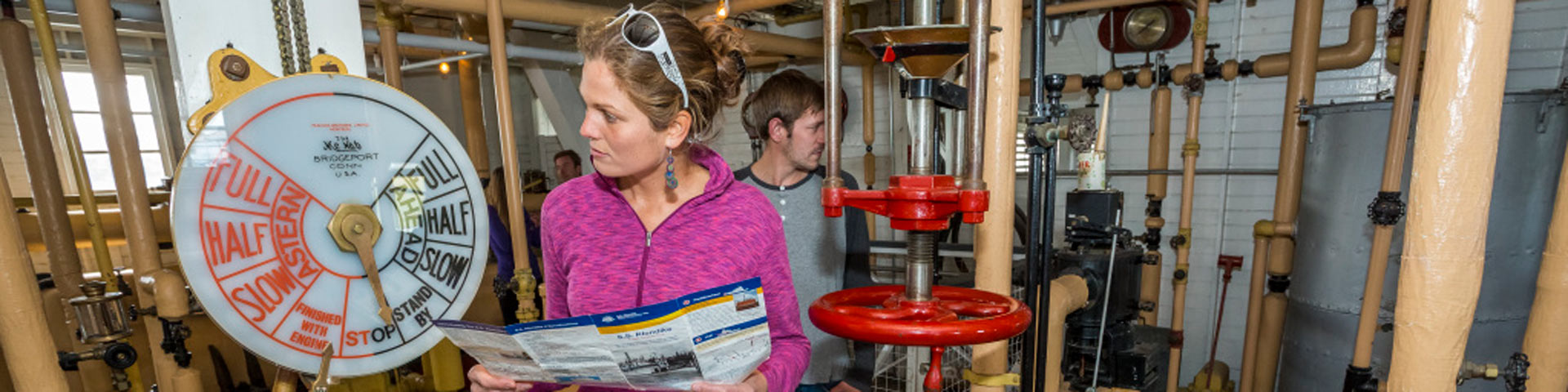 Visitors explore the engine room at S.S. Klondike National Historic Site