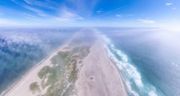 Aerial view of Sable Island through a light layer of fog.