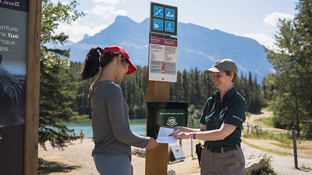 parks canada staff showing visitor ais self-certification permit 