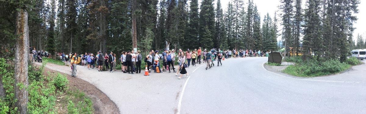 Visitors waiting for a return shuttle at Upper Lake Louise, 2018.