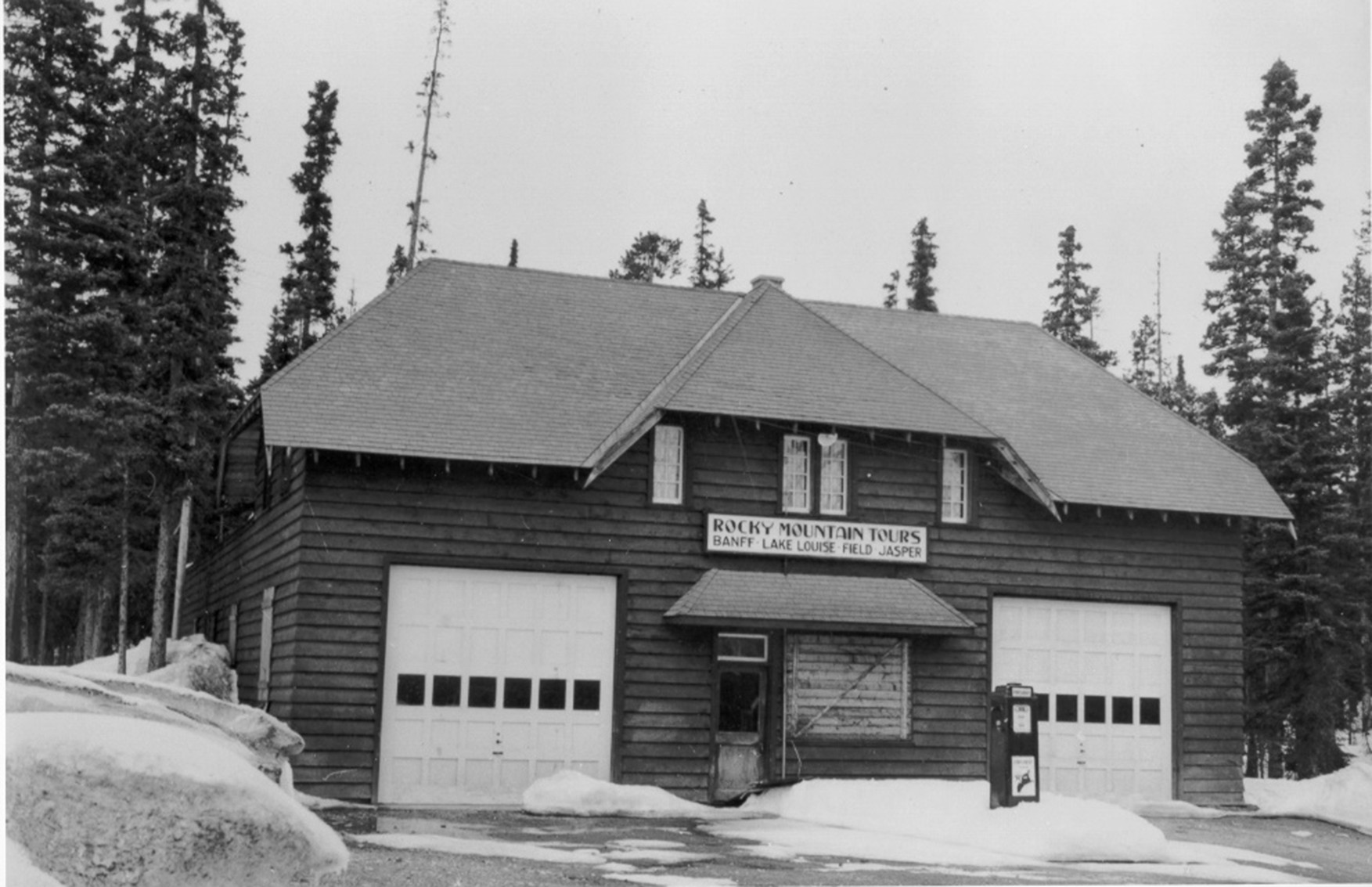 Building designed for bus storage signed Rocky Mountain Tours Banff Lake Louise Field Jasper