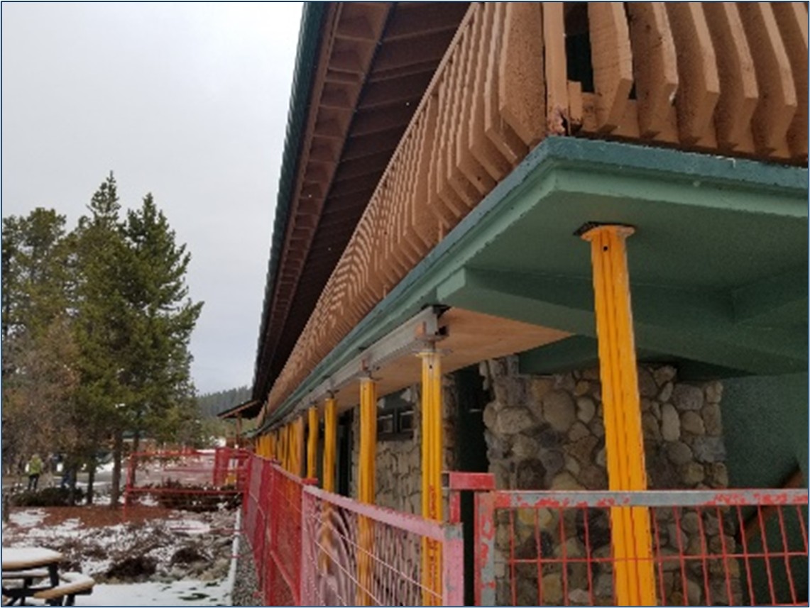 Braces support a balcony while the structure undergoes renovation
