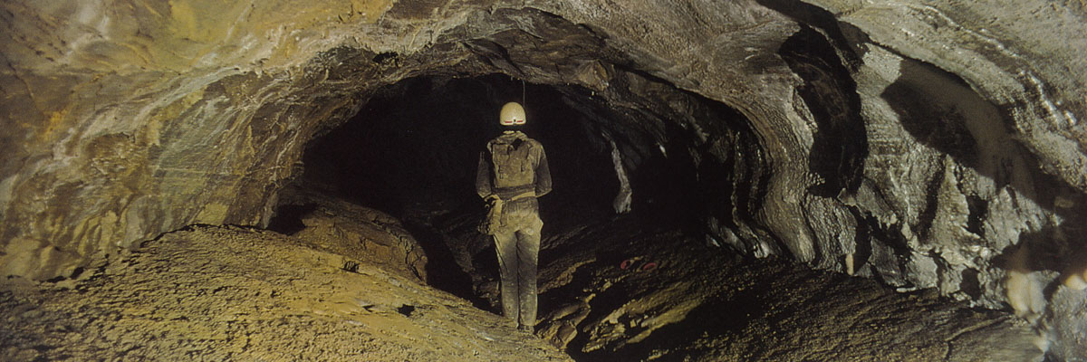 An expedition member stands in the 