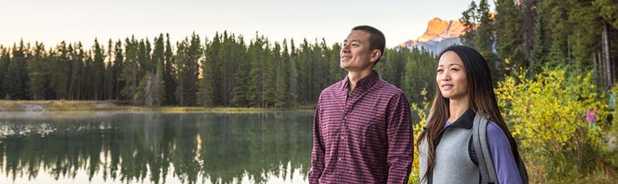 couple over looks mountain lake in the fall 