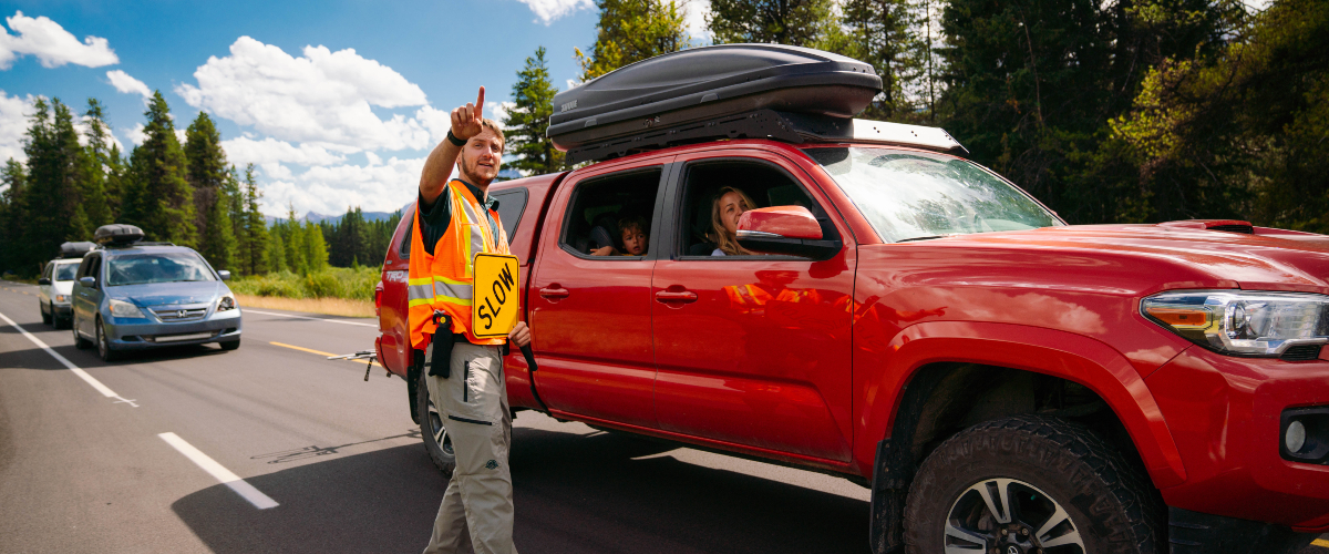 A Parks Canada employee directing traffic.
