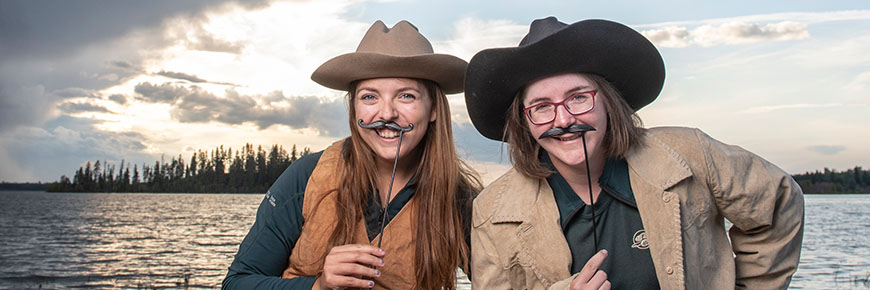 Two park interpreters deliver a historic program dressed in period garments.