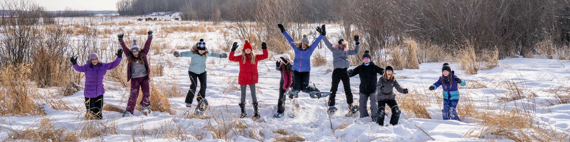 A group of girls pose for a photo near the Tawayik Lake Trail in Elk Island National Park.