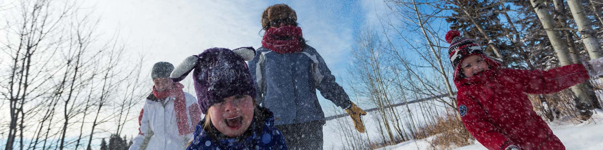 Family plays in the snow, Elk Island National Park