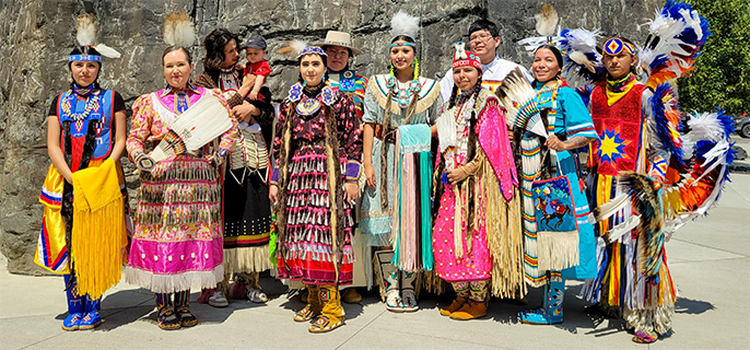 Powwow dancers at the Visitor Center Plaza