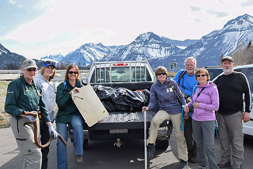 A group of volunteers with Parks Canada staff