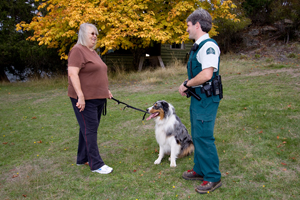 Visitor with a dog on a leash