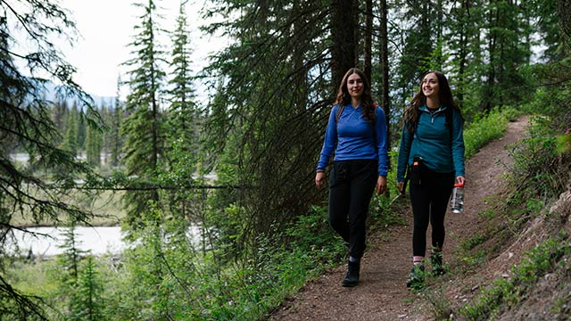 Two women hiking on trail