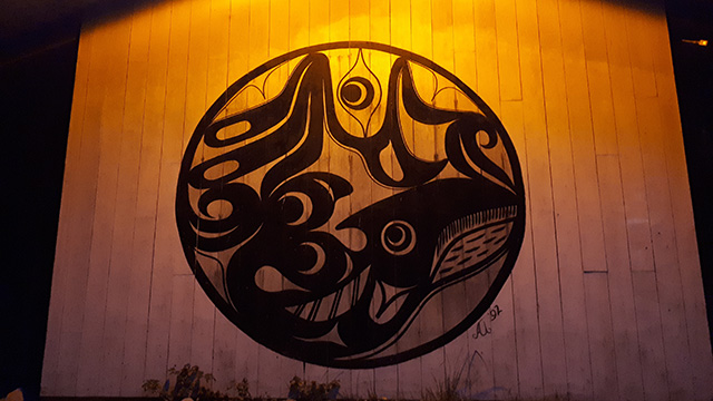 an indigenous drawing on the side of a building
