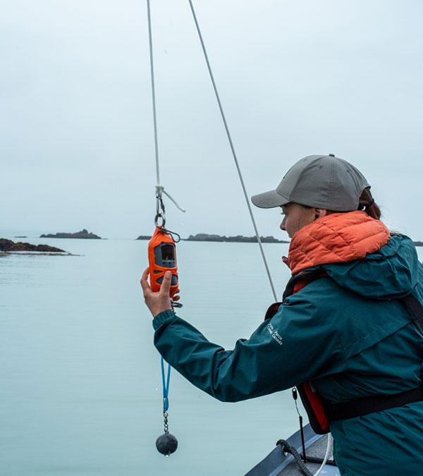 a person on the side of a boat