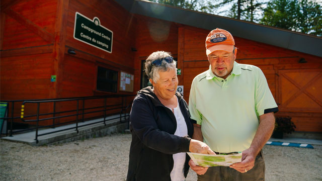 Two people looking at a map infront of the visitors centre