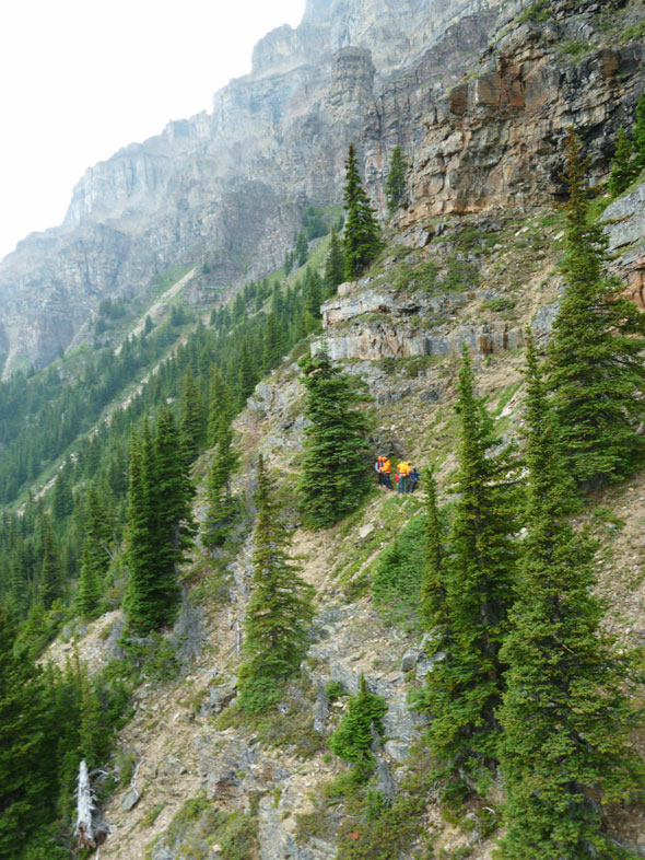 A Visitor Safety Specialist prepares to grab the line and sling out with the first stranded mountaineer. 