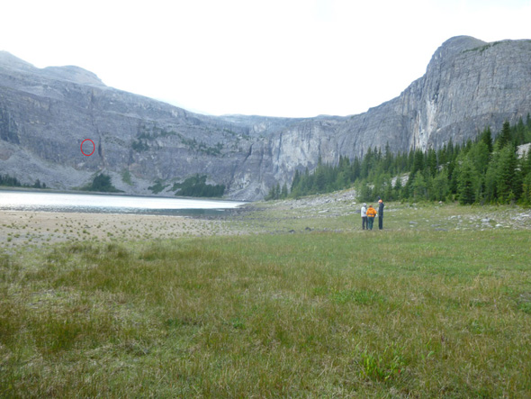A Visitor Safety Specialist debriefs with the stranded scrambler and his friend. The location of the recovery is circled in red. 