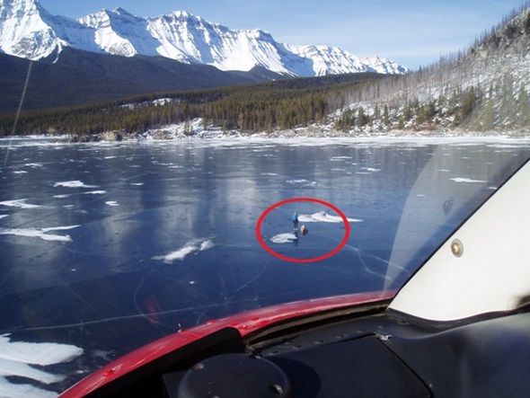The rescue scene showing the injured skater on Lake Minnewanka