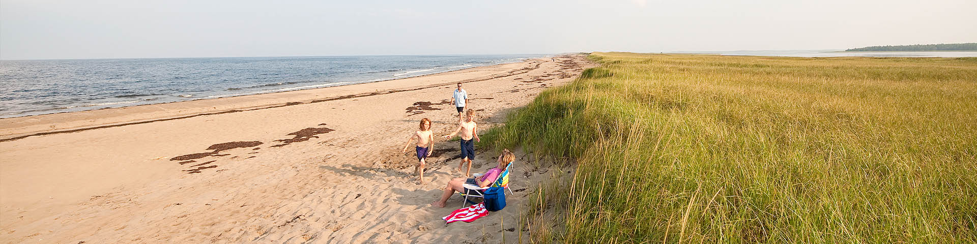 A family on a dune beach