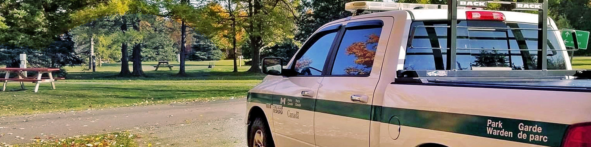 A warden truck parked in the campground