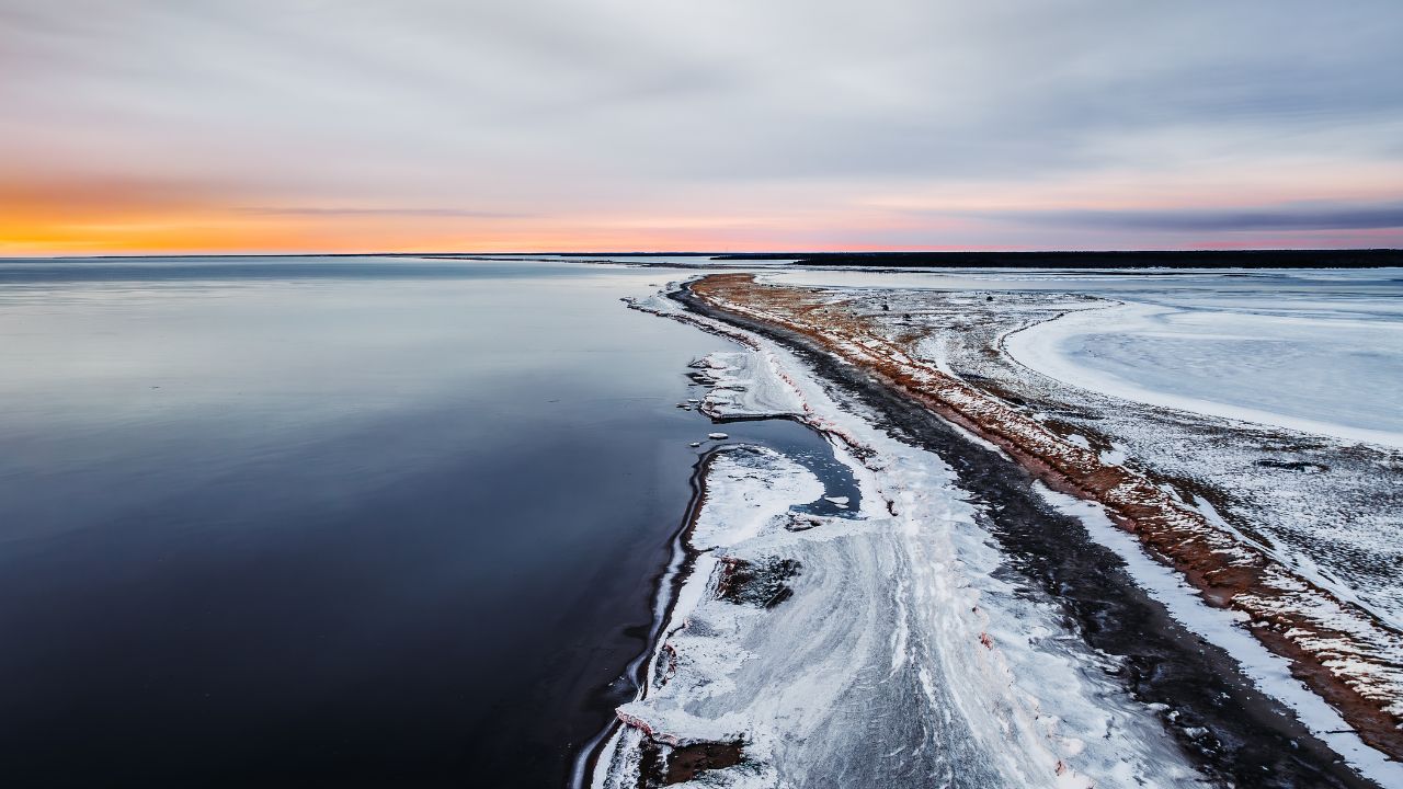 Aerial view of the southern tip of Kouchibouguac North Dune in the winter time, at sunrise.