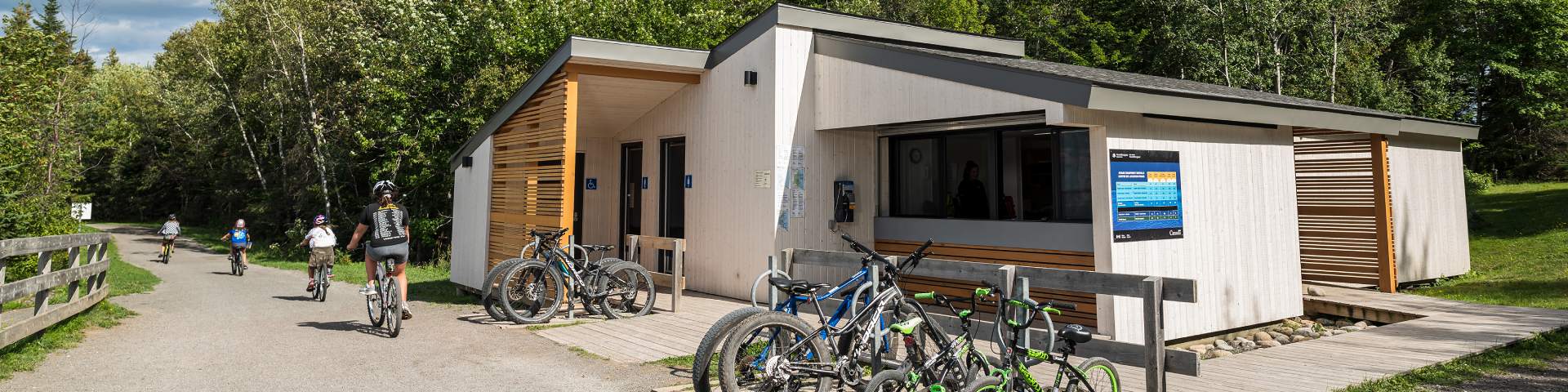Visitors biking next to Ryans Rental Centre.