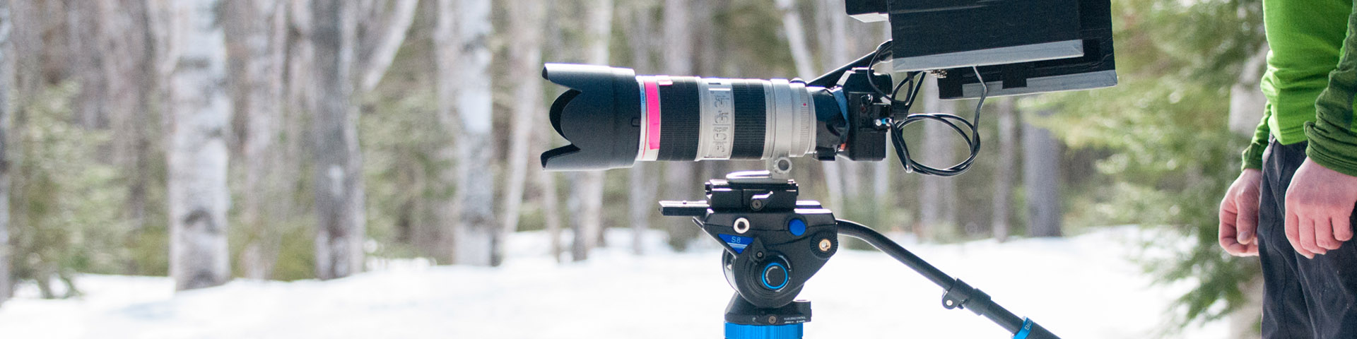 Professional photo and video equipment in the forest during winter.
