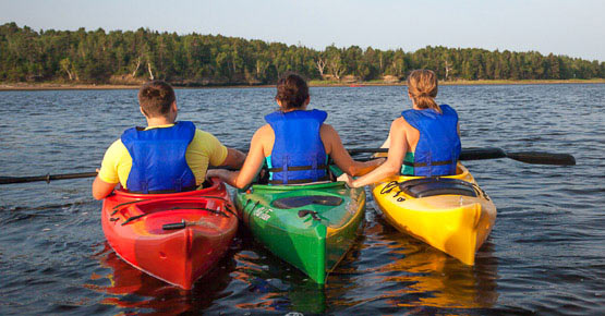 Three kayakers on the river