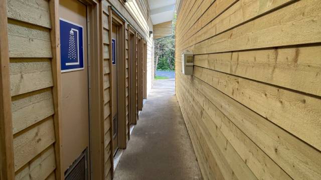 A narrow hallway with a concrete floor.