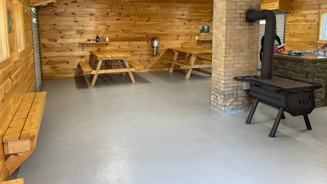 Interior of kitchen shelter with a kitchen sink and counter space.
