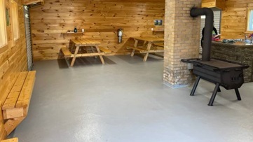 Interior of kitchen shelter with a kitchen sink and counter space.
