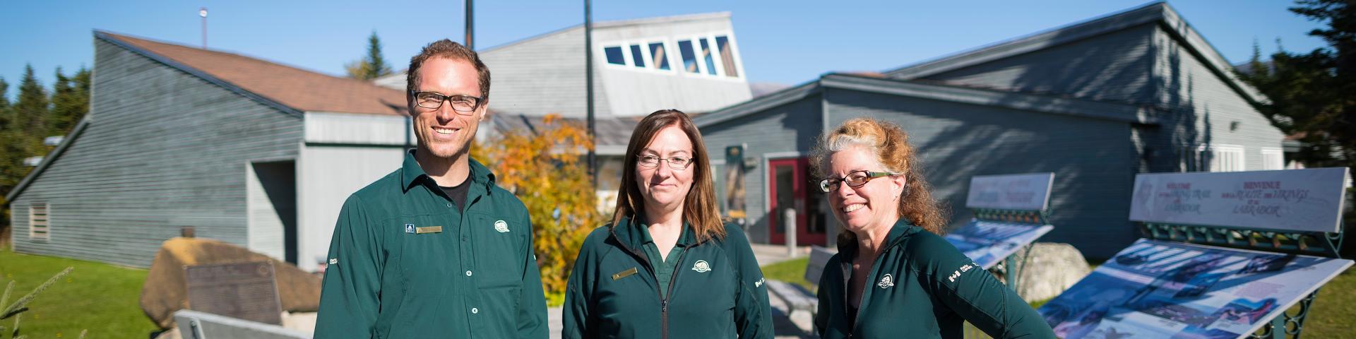 Parks Canada staff standing outside the visitor centre.