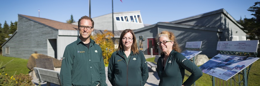 Parks Canada staff standing outside the visitor centre