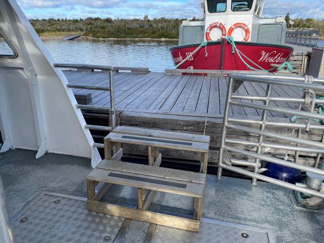 Two steps from a dock to a level boat deck.