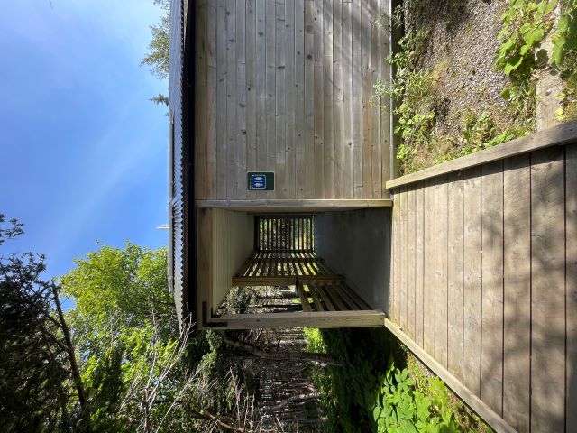 A wooden ramp leading to a wooden building.