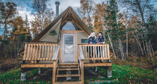 two people standing on the deck of an oTENtik