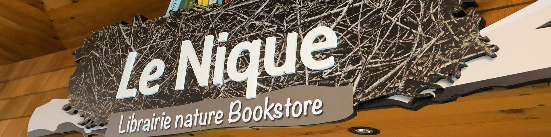 Le Nique Bookstore sign.