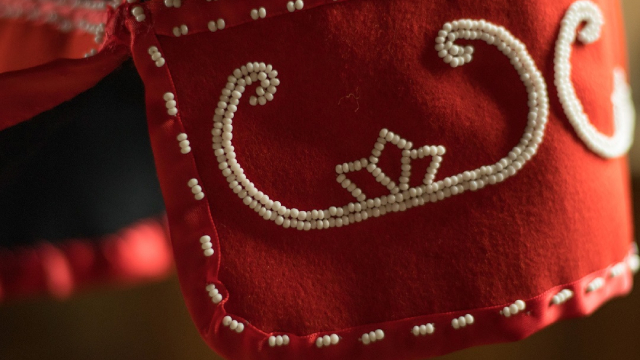 Mi'kmaq beadwork adorning the cuff of a wool coat.