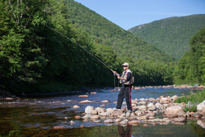 Man fishing in Cape Breton Highlands