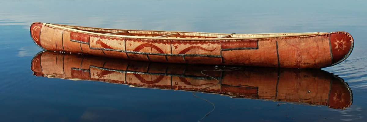 A birchbark canoe on water.