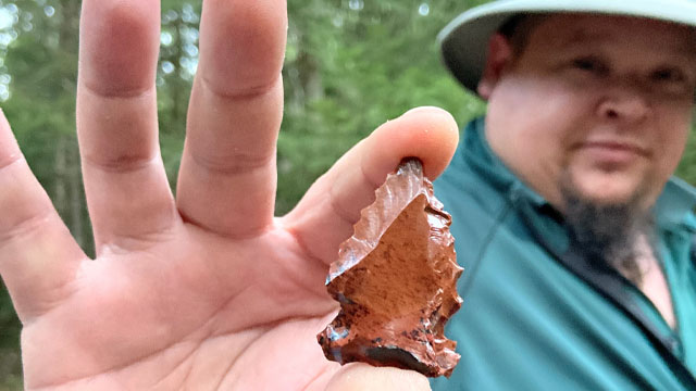 Nick holding a flint
