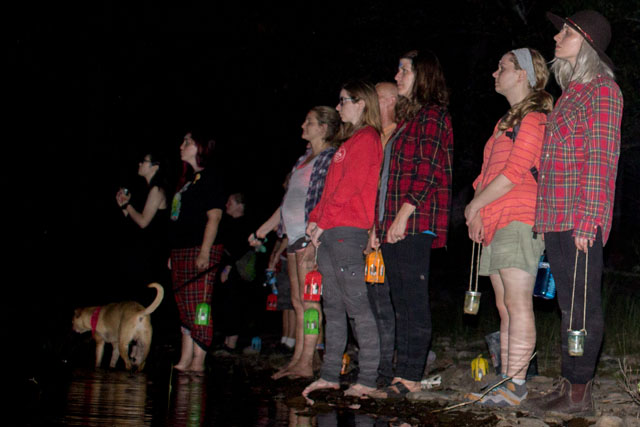 A group of visitors on a night hike.