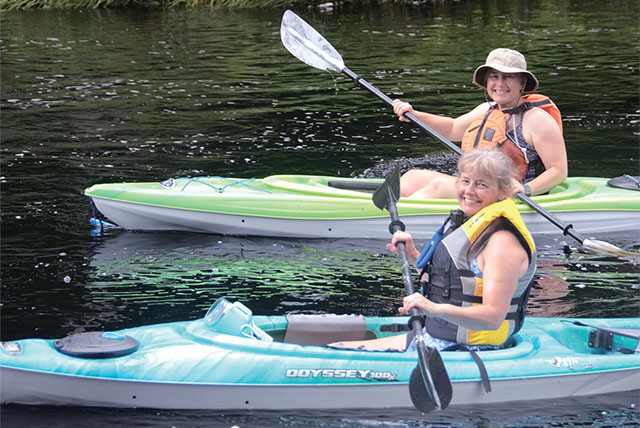 Two people in kayaks.