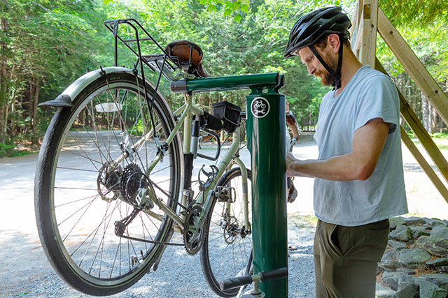 A person fixing a bicycle.