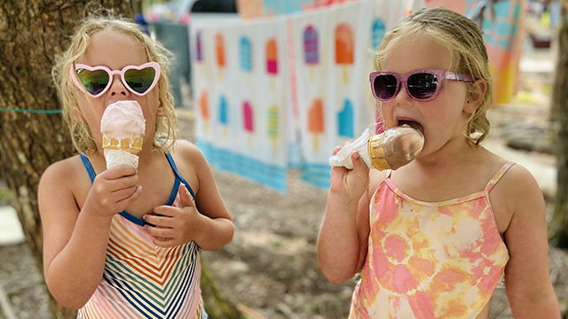 Two girls with ice cream cones.