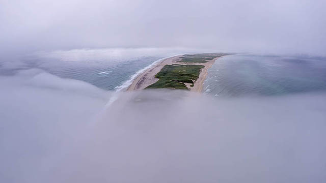 An aerial view of Sable Island East Spit as fog creeps in.